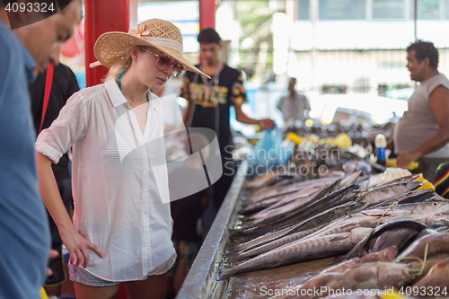 Image of Traveler shopping on traditional Victoria fish market, Seychelles.