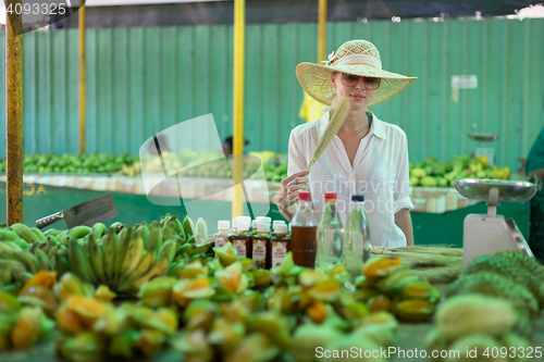 Image of Traveler shopping on traditional Victoria food market, Seychelles.