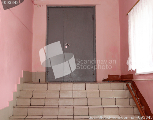 Image of The front metal door with stairs.