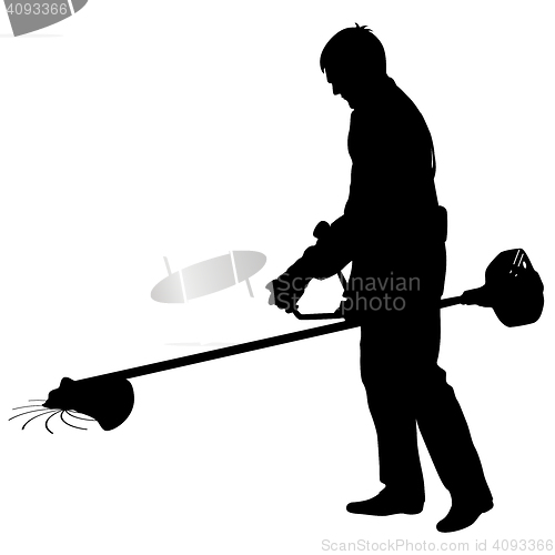 Image of Silhouette worker of a garden cuts off  grass. 