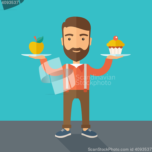 Image of Man carries with his two hands cupcake and apple.