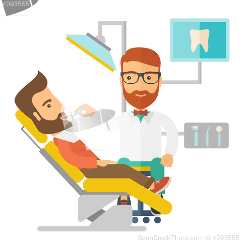 Image of Dentist man examines a patient teeth in the clinic