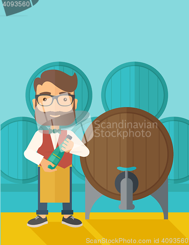 Image of Wine maker inspecting wine from barrel.