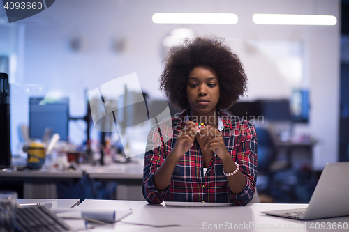 Image of portrait of a young successful African-American woman in modern 