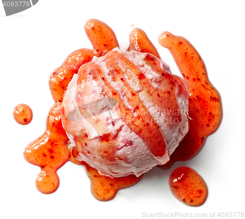 Image of ice cream ball with strawberry sauce