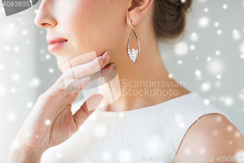 Image of close up of beautiful woman face with earring