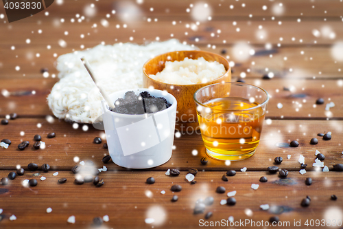 Image of coffee scrub in cup and honey on wood