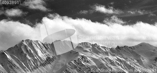 Image of Black and white panoramic view on snow winter mountains and sunl