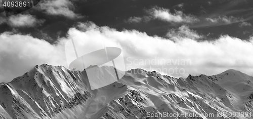 Image of Black and white panoramic view on snow winter mountains and sunl