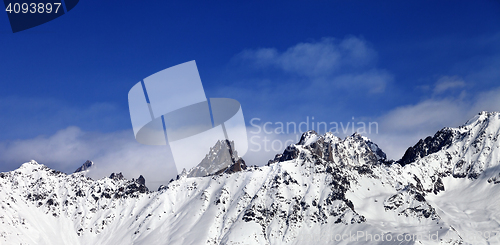 Image of Panoramic view on snowy mountains at sun day