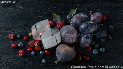 Image of berries bunch, basil and figs