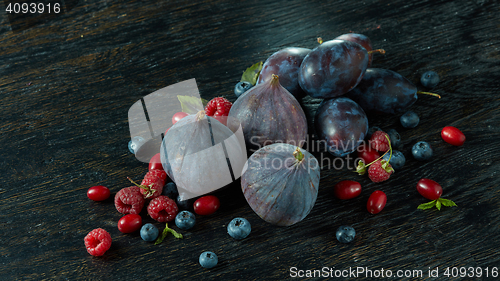 Image of Healthy food. A lot of ripe juicy berries and figs