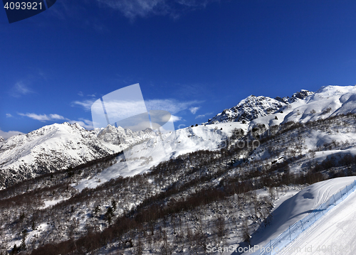 Image of Snow mountain and ski slope in sun day