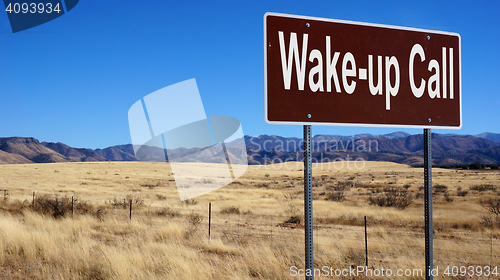 Image of Wake up Call brown road sign