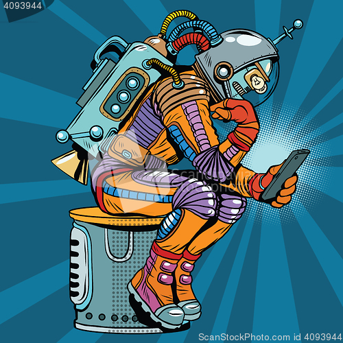 Image of Retro robot astronaut in the thinker pose reads smartphone