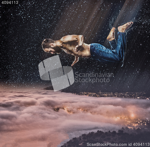 Image of The male break dancer in water.