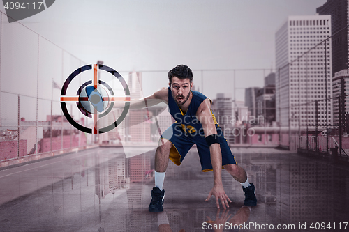 Image of Full length portrait of a basketball player with ball