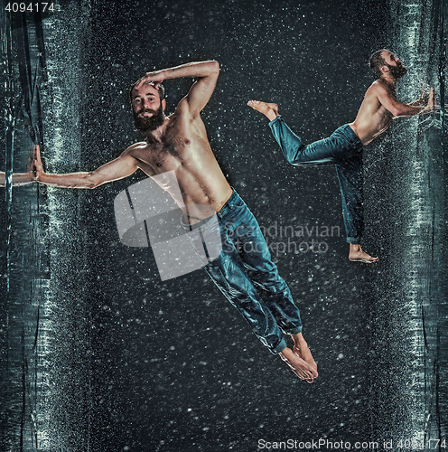 Image of The male break dancer in water.