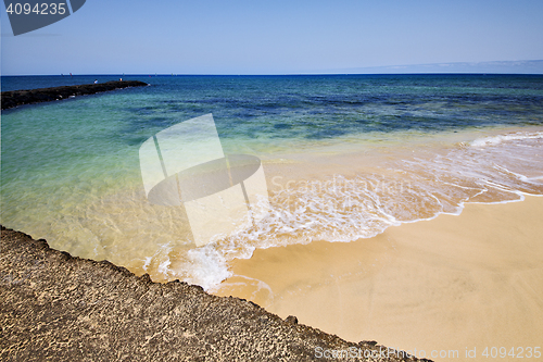 Image of spain harbor pier boat in the blue sky   