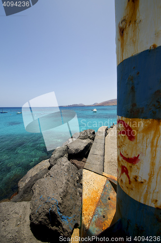 Image of lighthouse and boat in the blue    arrecife teguise