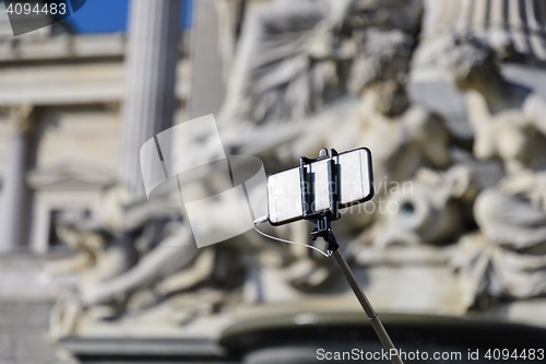 Image of Smartphone with selfie stick 