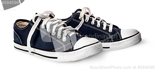 Image of One pair of dark blue sports shoes beside