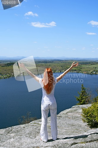 Image of Happy woman on the mountain