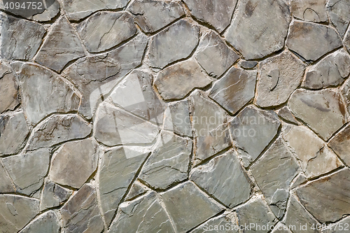 Image of Fragment of an ancient wall from stones. (Background image)