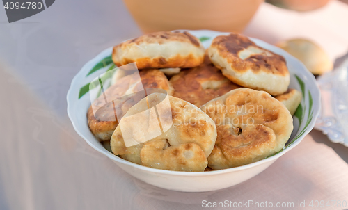 Image of Cakes on a ceramic dish on the table.