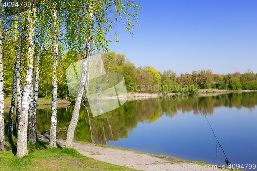 Image of Large beautiful lake, with banks overgrown with forest.