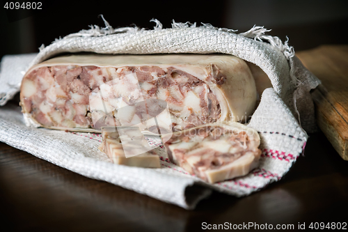 Image of Appetizer of meat wrapped in a napkin.