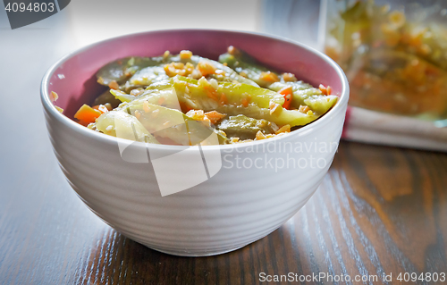 Image of Marinated cucumbers with carrots and spices.