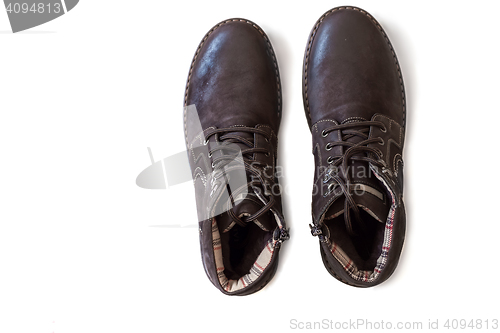 Image of Mens shoes for winter on a white background.