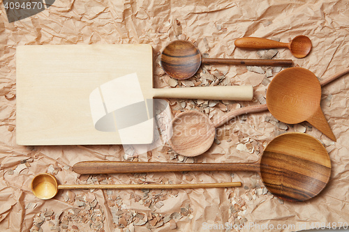 Image of wooden kitchen utensil on baking paper