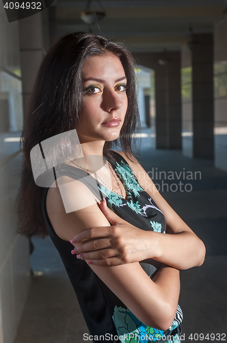 Image of Beautiful young girl in dress in town
