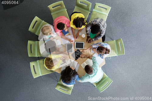 Image of group of students with tablet pc at school library