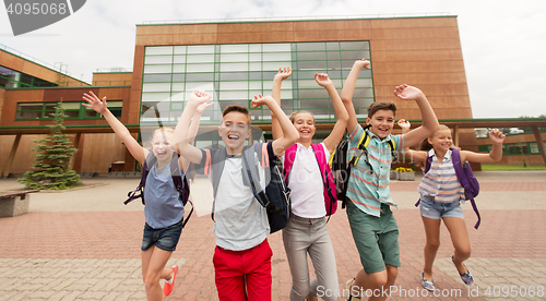 Image of group of happy elementary school students running