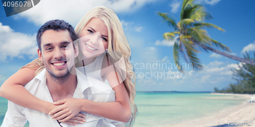 Image of happy couple having fun over beach background