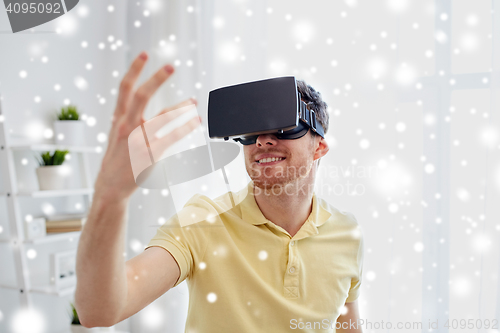 Image of young man in virtual reality headset or 3d glasses