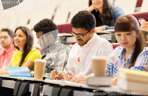 Image of group of students with coffee writing on lecture