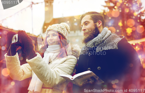 Image of couple taking selfie with smartphone in old town