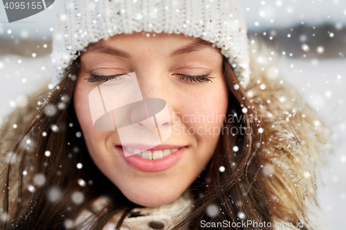 Image of happy woman outdoors in winter