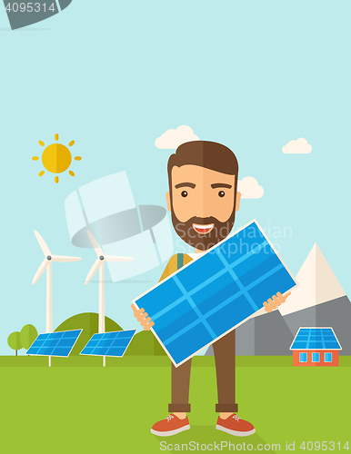 Image of Man holding a solar panel.