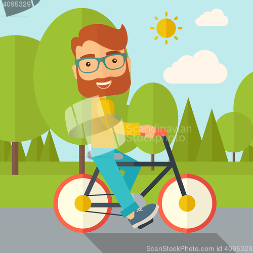 Image of Man riding a bicycle.