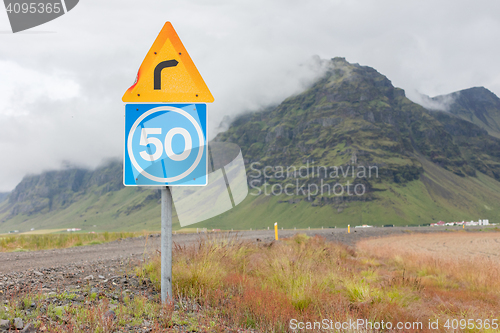 Image of Curve with advisory speed limit