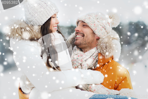 Image of happy couple outdoors in winter