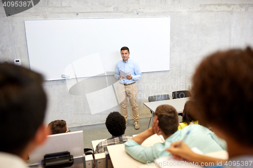 Image of group of students and teacher at lecture