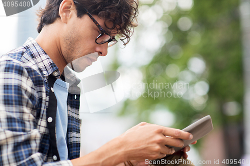 Image of close up of man with tablet pc outdoors