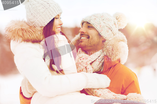 Image of happy couple outdoors in winter