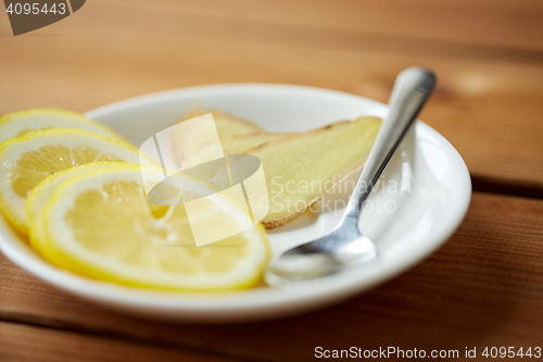 Image of lemon and ginger on plate with spoon